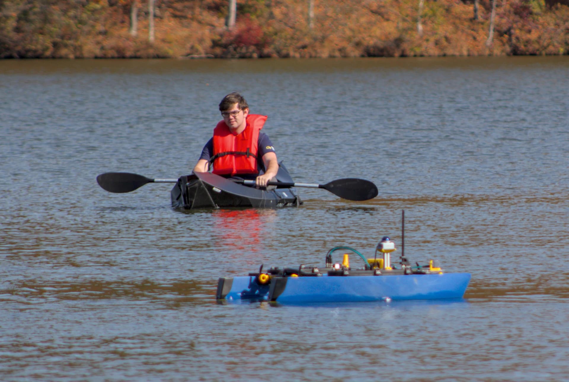 Undergraduate Researcher Mitchell Turton with MRG BlueBoat ASV