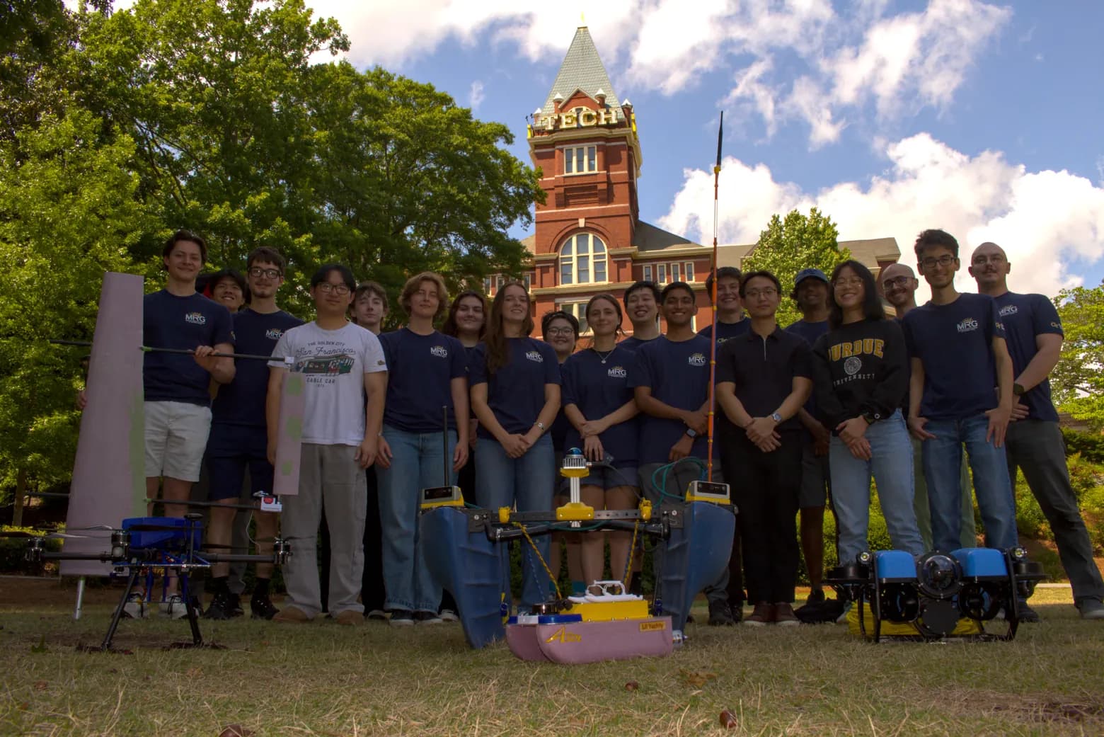 The Marine Robotics Group team with their vehicles in front of Tech Tower