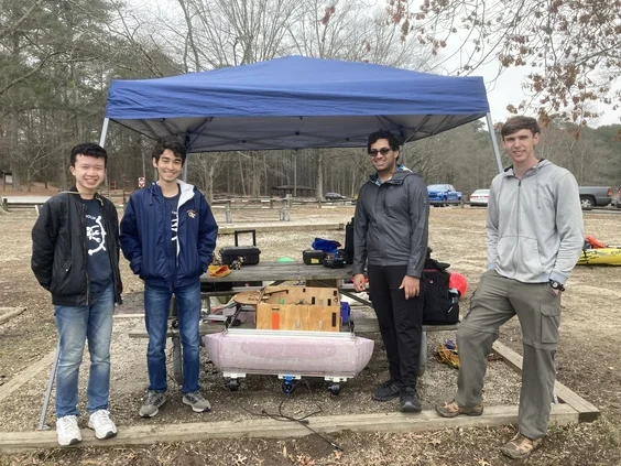 Members testing a robot at a local lake