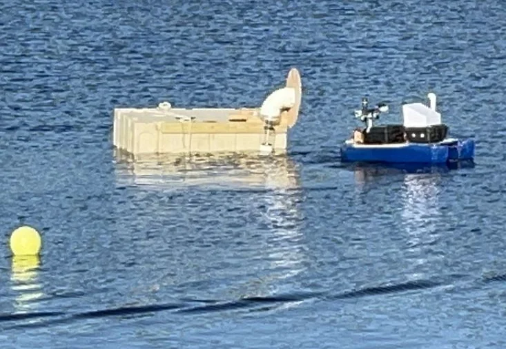 MRG's robot attempting the watershooting task at RoboBoat 2023.